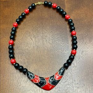 Vintage pendant necklace with enamelled black & red breast plate